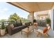 Outdoor balcony with a comfortable seating area and views of the surrounding greenery at 13351 W Alameda Pkwy # 203, Lakewood, CO 80228