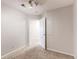 Unfurnished bedroom featuring neutral walls and carpet, with an open door leading to another room at 13351 W Alameda Pkwy # 203, Lakewood, CO 80228