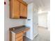 Office nook with built-in desk and storage cabinets situated near the entrance of the unit at 13351 W Alameda Pkwy # 203, Lakewood, CO 80228