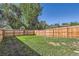 A full wooden fence offers privacy in this grassy backyard at 4812 W 8Th Ave, Denver, CO 80204