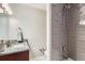 Updated bathroom with a subway-tiled shower and granite countertops at 4812 W 8Th Ave, Denver, CO 80204