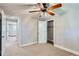Well-lit bedroom with a ceiling fan, carpet, and a walk-in closet at 4812 W 8Th Ave, Denver, CO 80204