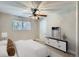 Comfortable bedroom with a ceiling fan and ample natural light at 4812 W 8Th Ave, Denver, CO 80204