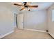 Bright bedroom with neutral walls, carpet, and a ceiling fan at 4812 W 8Th Ave, Denver, CO 80204