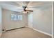 Cozy bedroom with carpet flooring, ceiling fan and large window at 4812 W 8Th Ave, Denver, CO 80204