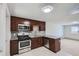 Well-equipped kitchen with stainless steel appliances, granite countertops, and ample storage space at 4812 W 8Th Ave, Denver, CO 80204