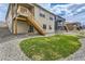Backyard with low maintenance gravel and grass area at 4815 Cattle Cross Rd, Castle Rock, CO 80104