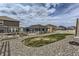 Backyard with low maintenance gravel and grass area at 4815 Cattle Cross Rd, Castle Rock, CO 80104