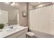 Bathroom with white sink and countertop, a shower and tub combination, and neutral colored walls at 4815 Cattle Cross Rd, Castle Rock, CO 80104