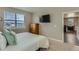 Bedroom with a wall-mounted television, carpet flooring, and view to the dining room at 4815 Cattle Cross Rd, Castle Rock, CO 80104