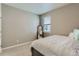Bedroom featuring carpet flooring, neutral color walls, and a mirror at 4815 Cattle Cross Rd, Castle Rock, CO 80104