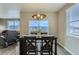 Cozy dining area with views, perfect for Gathering meals and entertaining at 4815 Cattle Cross Rd, Castle Rock, CO 80104
