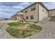 Exterior view of house with low maintenance gravel and small grass area at 4815 Cattle Cross Rd, Castle Rock, CO 80104