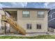 Exterior view of house with wood staircase and siding at 4815 Cattle Cross Rd, Castle Rock, CO 80104