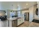Modern kitchen with stainless steel appliances and an island, ideal for cooking and gatherings at 4815 Cattle Cross Rd, Castle Rock, CO 80104