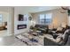 Comfortable living room featuring a modern fireplace and ample seating at 4815 Cattle Cross Rd, Castle Rock, CO 80104