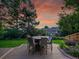 Outdoor dining on a wooden deck, creating an inviting space for enjoying meals with a sunset backdrop at 6359 S Locust Way, Centennial, CO 80111