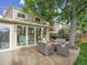 Home backyard with a composite deck, outdoor seating, and mature trees at 6359 S Locust Way, Centennial, CO 80111