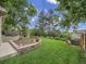 Lush backyard with a composite deck and stone landscaping features at 6359 S Locust Way, Centennial, CO 80111