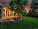 Landscaped backyard with a wooden deck and outdoor seating, creating a perfect spot for relaxing and entertaining at 6359 S Locust Way, Centennial, CO 80111