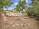 The spacious backyard features a stone retaining wall and landscaped areas at 6359 S Locust Way, Centennial, CO 80111