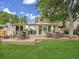 Home backyard with a composite deck, outdoor seating, and lush lawn at 6359 S Locust Way, Centennial, CO 80111