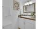 Cozy bathroom with decorative painting, classic white sink, and vanity at 6359 S Locust Way, Centennial, CO 80111