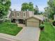 Charming two-story home with manicured lawn and attached two car garage at 6359 S Locust Way, Centennial, CO 80111