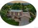 Charming home with manicured lawn, lovely landscaping, and attractive brick exterior at 6359 S Locust Way, Centennial, CO 80111