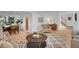 Open concept living space with hardwood floors and seamless flow to dining area at 6359 S Locust Way, Centennial, CO 80111