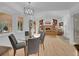 Bright living room with vaulted ceilings, built-in shelving, and beautiful hardwood floors at 6359 S Locust Way, Centennial, CO 80111