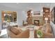 Inviting living room with a cozy fireplace and built-in bookshelves for a relaxing atmosphere at 6359 S Locust Way, Centennial, CO 80111