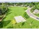 Aerial view of the neighborhood park with walking trails, basketball court, and open space at 6359 S Locust Way, Centennial, CO 80111