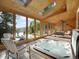 Bright sunroom with hot tub, lots of windows and beautiful backyard views and a vaulted ceiling at 6359 S Locust Way, Centennial, CO 80111