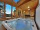 Sunroom with hot tub, vaulted ceiling, wooden ceiling and access to the beautiful backyard at 6359 S Locust Way, Centennial, CO 80111