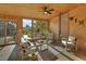Charming sunroom featuring a vaulted ceiling and walls of windows, perfect for relaxation at 6359 S Locust Way, Centennial, CO 80111