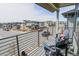 Relaxing balcony seating area with views of the surrounding neighborhood at 1345 W 67Th Pl, Denver, CO 80221
