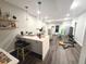 Open basement area featuring modern exercise equipment and luxury vinyl plank flooring at 1345 W 67Th Pl, Denver, CO 80221