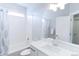 Bright bathroom with a shower-tub combo, and modern vanity with undermount sink at 1345 W 67Th Pl, Denver, CO 80221
