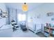 Charming Bedroom with a crib, changing table, decor, and lots of natural light at 1345 W 67Th Pl, Denver, CO 80221
