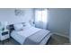 Cozy bedroom with soft lighting, comfortable bed, and neutral color palette at 1345 W 67Th Pl, Denver, CO 80221