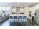 Stylish kitchen with a large center island, modern appliances, and seating at 1345 W 67Th Pl, Denver, CO 80221