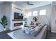 Cozy living room featuring a modern fireplace, TV, and comfortable seating at 1345 W 67Th Pl, Denver, CO 80221