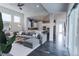 Spacious open-concept living area with modern kitchen and hardwood floors at 1345 W 67Th Pl, Denver, CO 80221