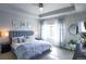 Comfortable main bedroom featuring a coffered ceiling, large window, and stylish decor at 1345 W 67Th Pl, Denver, CO 80221