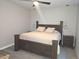 The main bedroom features a modern farmhouse design, stylish lighting, and neutral colors at 1345 W 67Th Pl, Denver, CO 80221