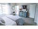 Bright main bedroom with access to the outdoor balcony with sleek furniture at 1345 W 67Th Pl, Denver, CO 80221