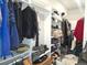 Spacious walk-in closet with extensive built-in shelving for optimal organization at 1345 W 67Th Pl, Denver, CO 80221
