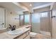 Clean bathroom with single vanity, shower, and updated fixtures at 2121 S Troy Way, Aurora, CO 80014