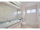 Bathroom includes a bathtub, toilet, and vanity at 2121 S Troy Way, Aurora, CO 80014